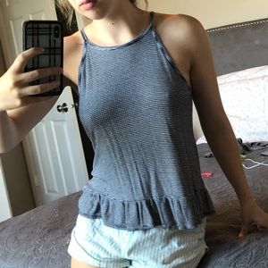 Navy and white striped tank. Ruffles on bottom.